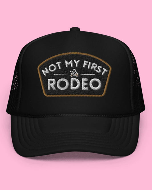 NOT MY FIRST RODEO black trucker cap