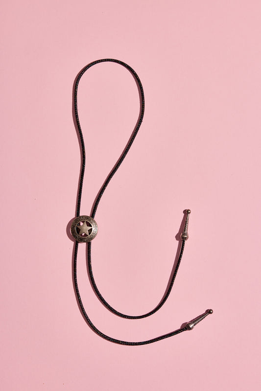 Handmade bolo tie with bright coloured cord and silver-look hardware, displayed on neutral background – western costume jewellery made in Australia