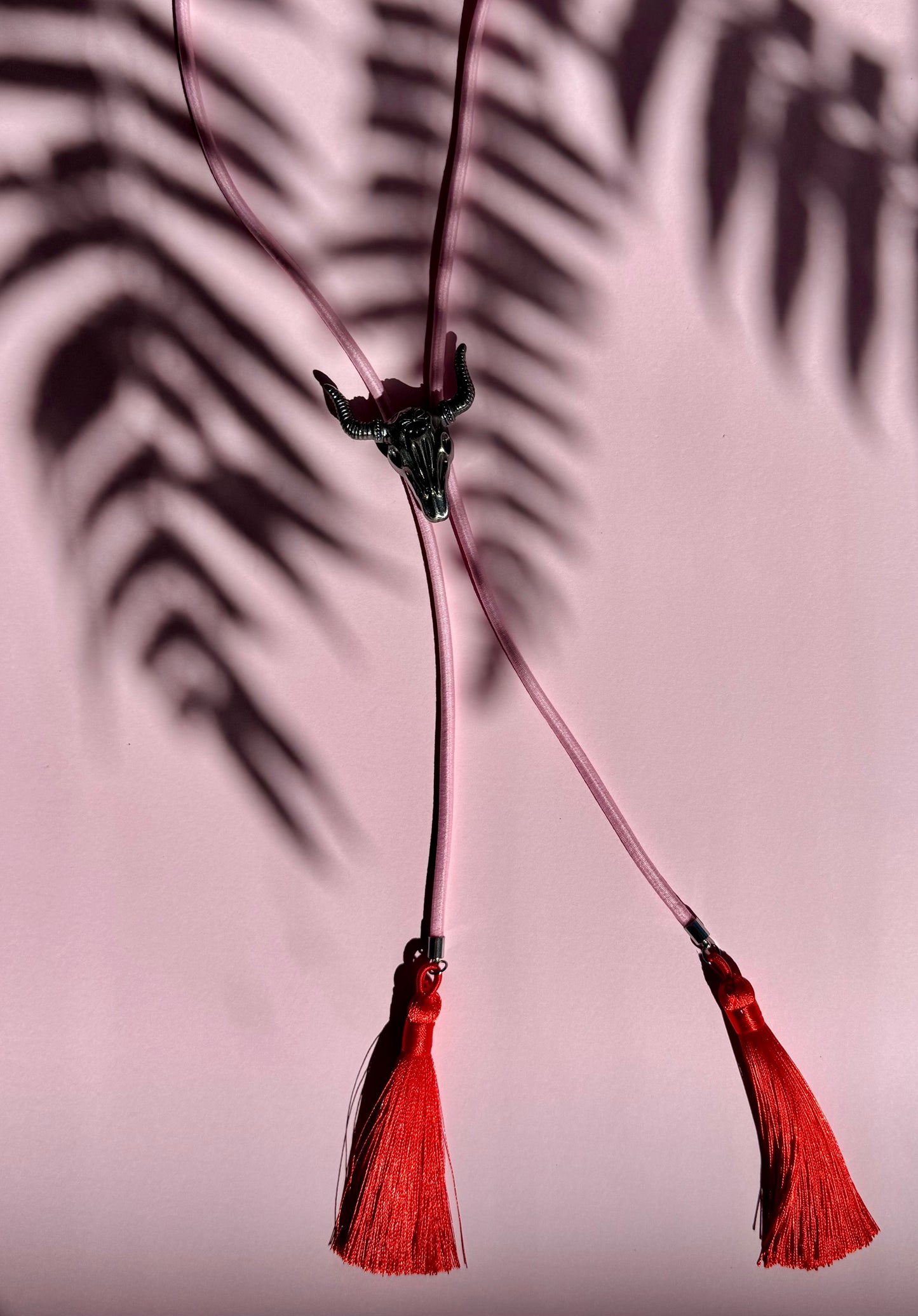 Bolo Tie with Bright Cord - Cow Skull & Red Silk Tassels