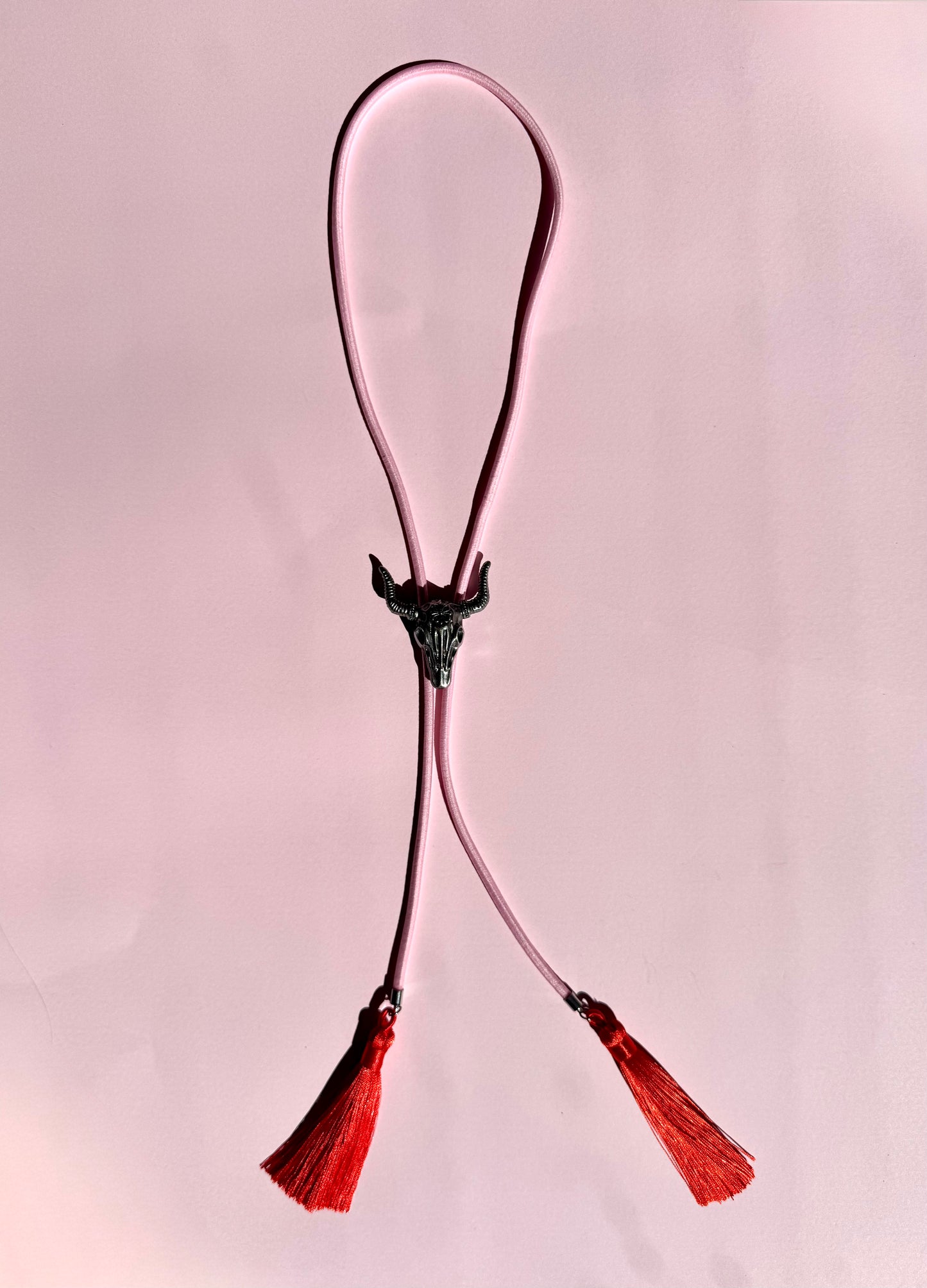 Bolo Tie with Bright Cord - Cow Skull & Red Silk Tassels